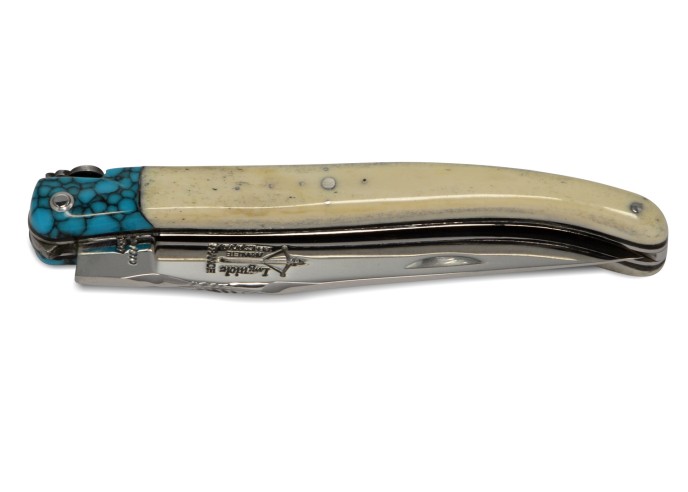 Laguiole pliant Forgé, manche en os de 12 cm avec une fausse mitre turquoise, finition brillant